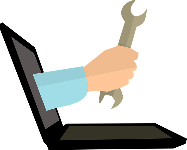 Laptop with a wrench coming out of it